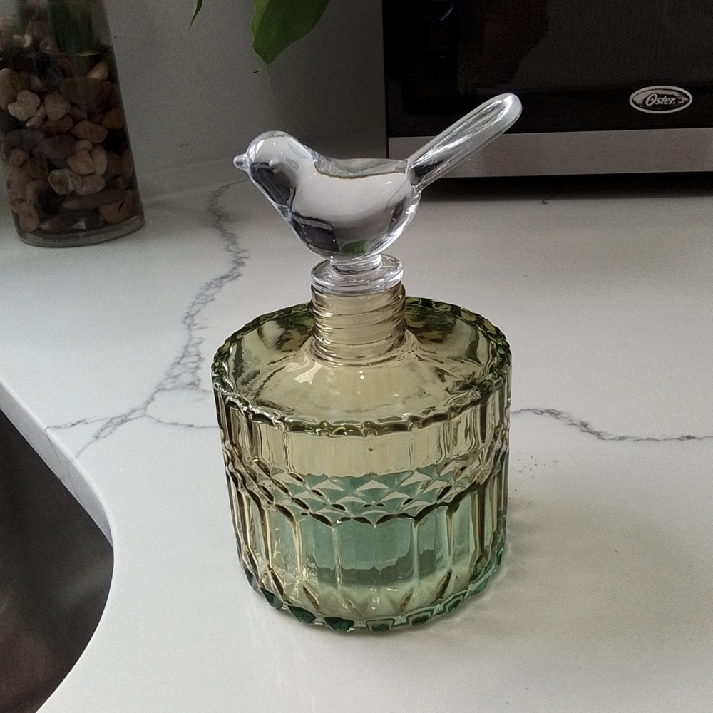 Bottle with bird topper